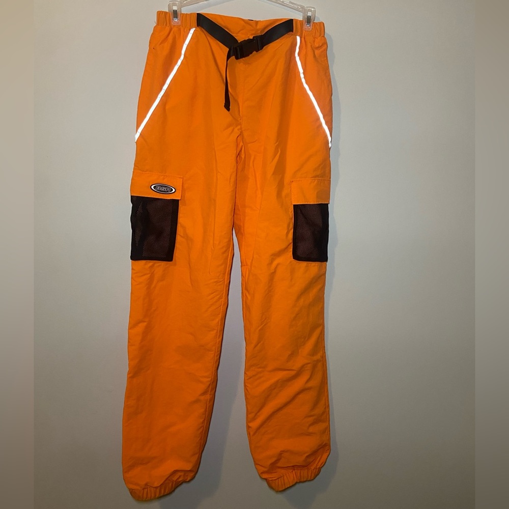 Neon orange track pants